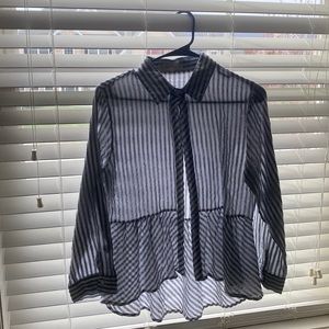 Women’s button down shirt with grey and white stripes. ruffled bottom.